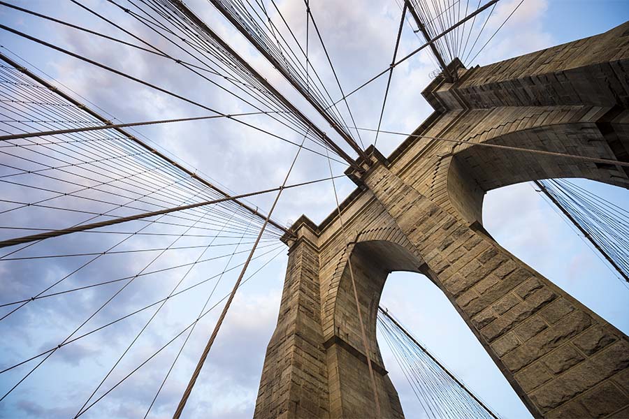 About Our Brokerage - Closeup View of the Brooklyn Bridge in New York City